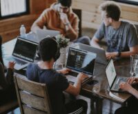 group of people using laptop computer