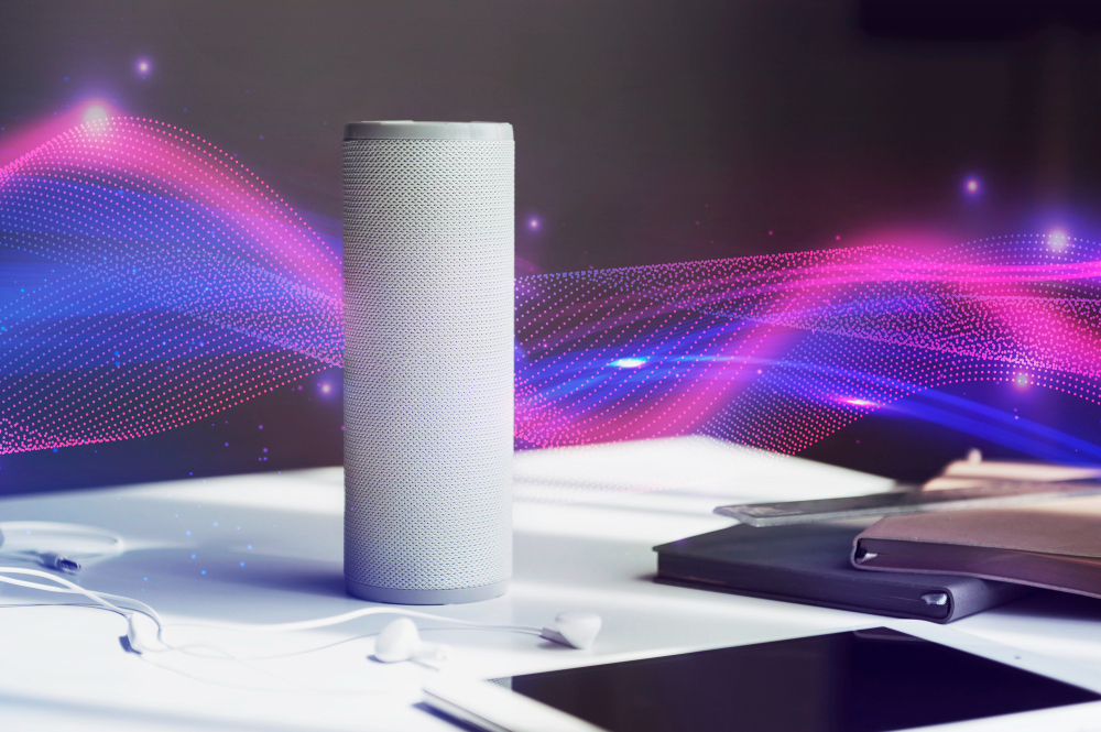Smart voice assistant speaker on a desk with colorful sound wave graphics symbolizing voice interaction and AI technology