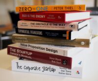 Collection of top entrepreneurship books for startups, featuring titles like Zero to One and The Corporate Startup
