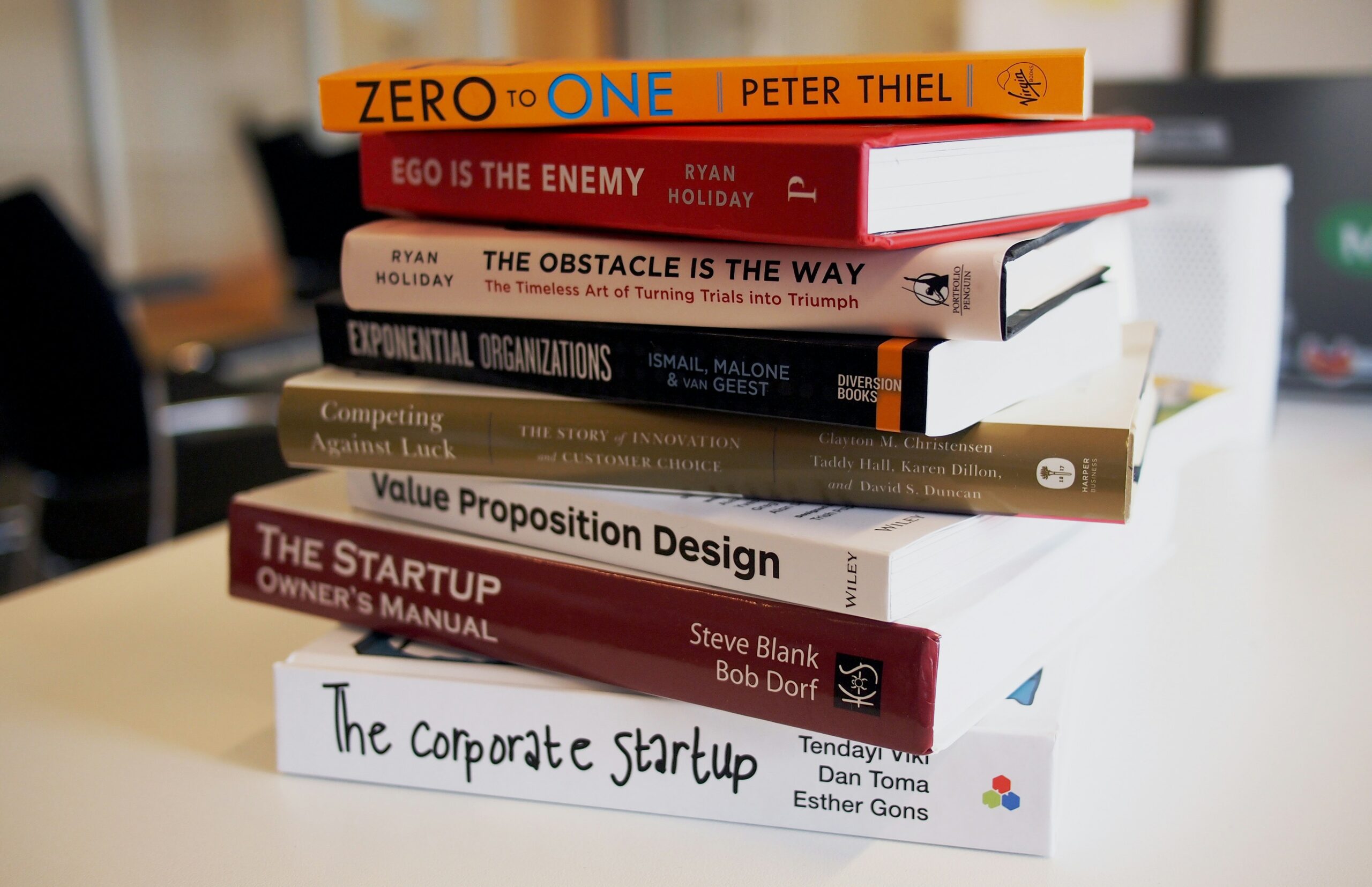 Collection of top entrepreneurship books for startups, featuring titles like Zero to One and The Corporate Startup