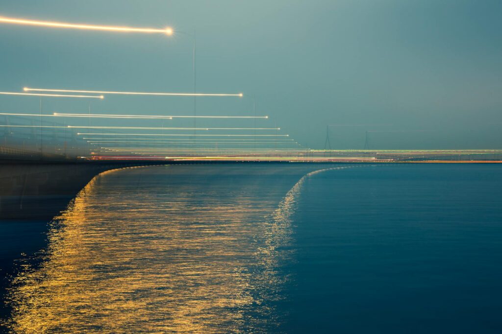 Golden coins flowing like a river, representing the abundance and financial success achievable through monetizing a Sri Lankan travel blog.