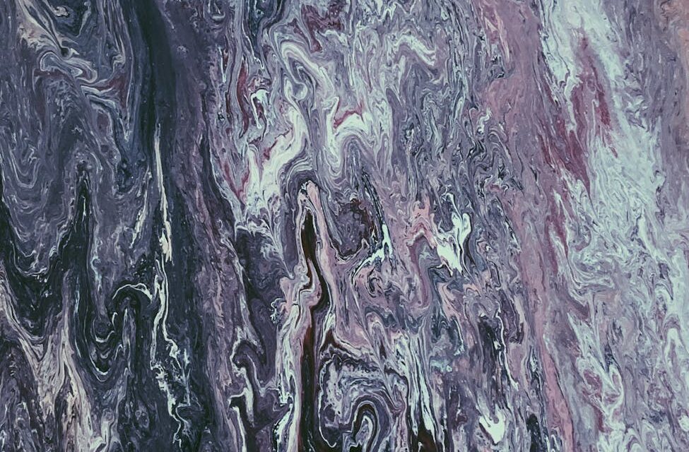 Vibrant abstract art swirling with colorful patterns, representing the creative potential of print-on-demand for artists.