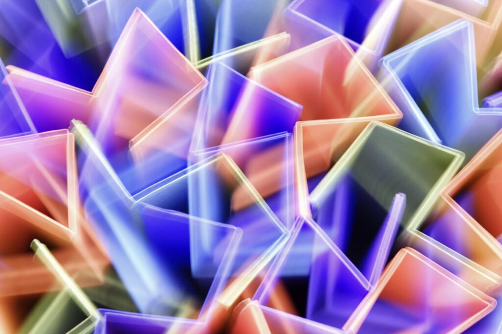 Geometric shapes and motion graphics symbolizing dynamic video editing for YouTube content.