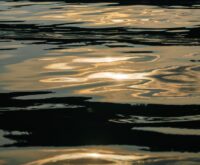 Abstract reflections of a vibrant sunset capturing the essence of the sunset stroll art.