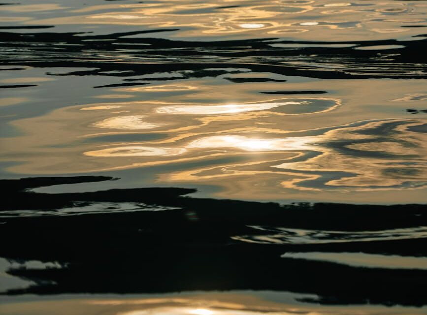 Abstract reflections of a vibrant sunset capturing the essence of the sunset stroll art.