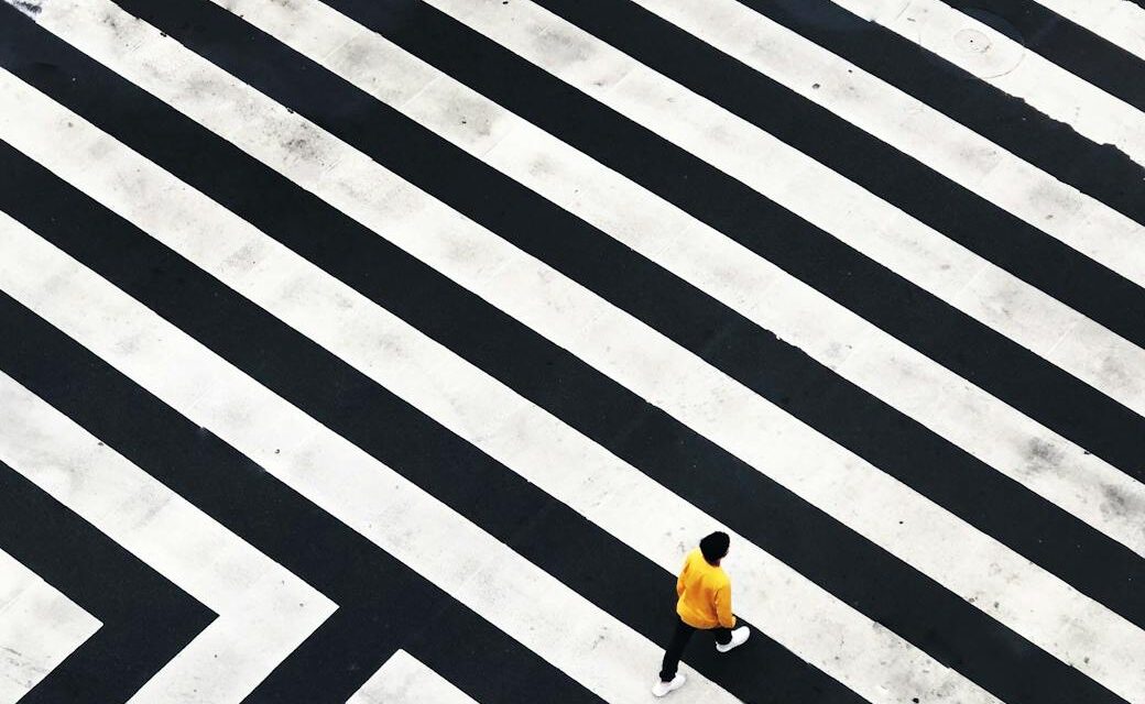 Abstract image of a compass representing direction and vision, highlighting the importance of leadership vs management.