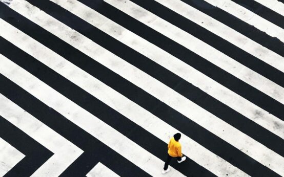 Abstract image of a compass representing direction and vision, highlighting the importance of leadership vs management.