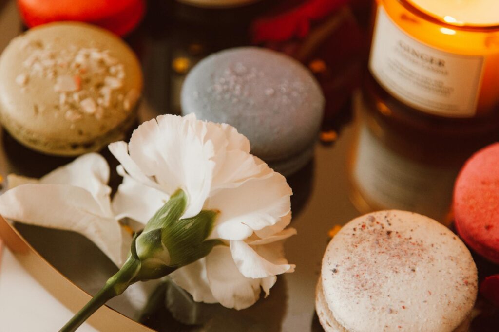 The warm glow of a pack scented candle reflecting on a surface, enhancing the travel experience with a touch of home.