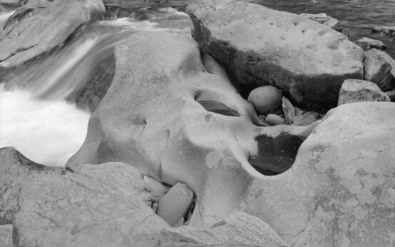 Smooth river stones evoking a sense of zen and relaxation, perfect for finding the best local massage experience.