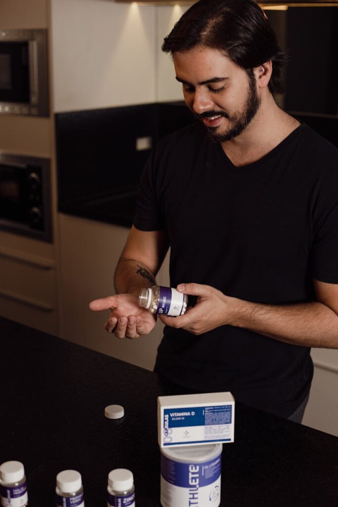 A close-up shot of a person's hands holding a packaged food item and carefully reading the ingredients list on the back.