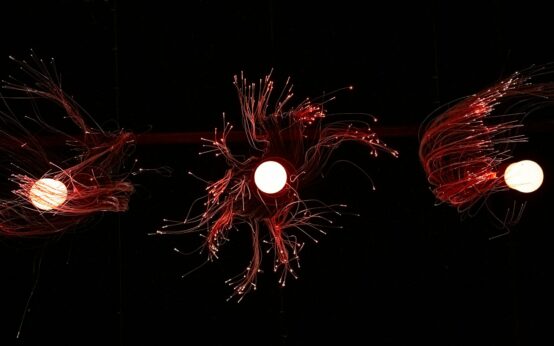 A complex web of interconnected glowing nodes representing a blockchain network.