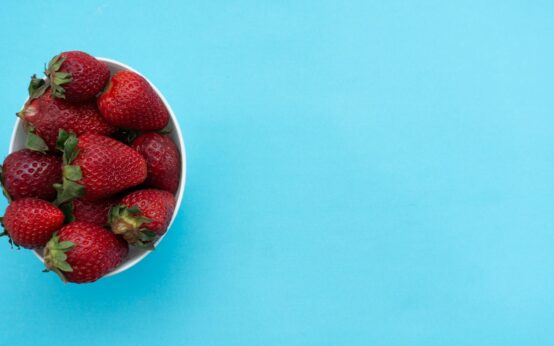 A top-down view of a delicious and colorful Buddha bowl filled with quinoa, chickpeas, avocado, and fresh greens, showcasing a healthy plant-based meal.