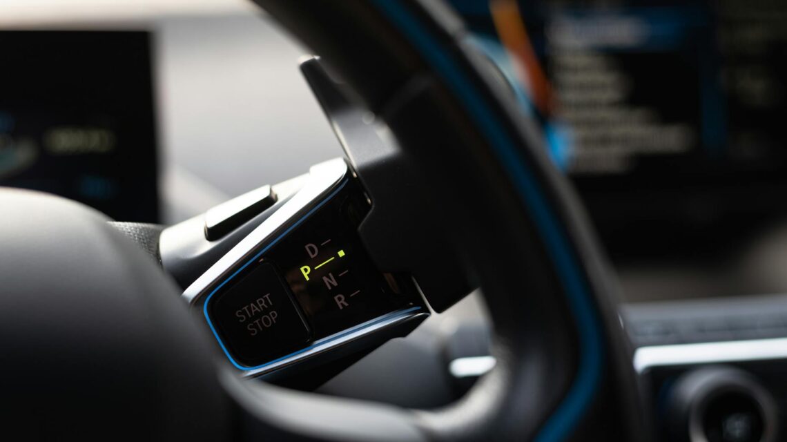 A futuristic, glowing dashboard of an autonomous vehicle showing a holographic map.