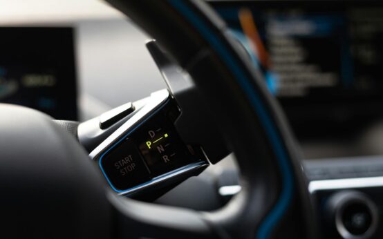 A futuristic, glowing dashboard of an autonomous vehicle showing a holographic map.