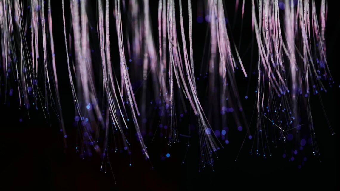 An abstract digital representation of a glowing blue blockchain network.