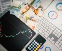 A dynamic graph showing global economic trends on a computer monitor.