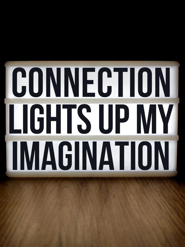 A single glowing lightbulb against a dark background, representing a brilliant business idea.