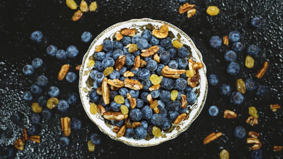 A vibrant assortment of immunity-boosting citrus fruits like oranges and grapefruits in a white bowl.