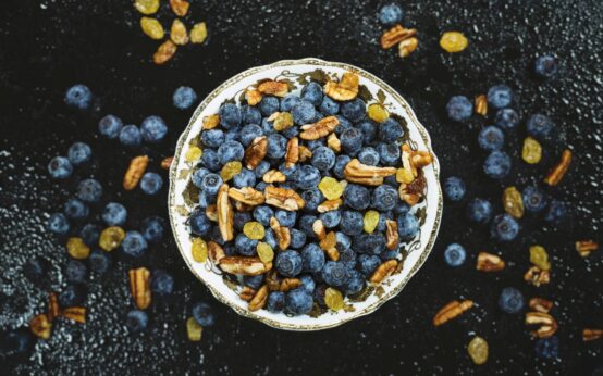 A vibrant assortment of immunity-boosting citrus fruits like oranges and grapefruits in a white bowl.