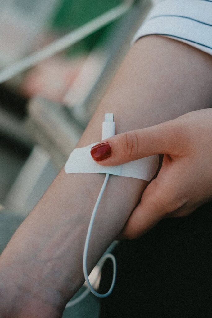 A close-up of a user's hand touching a transparent screen displaying a complex AI-driven data dashboard.
