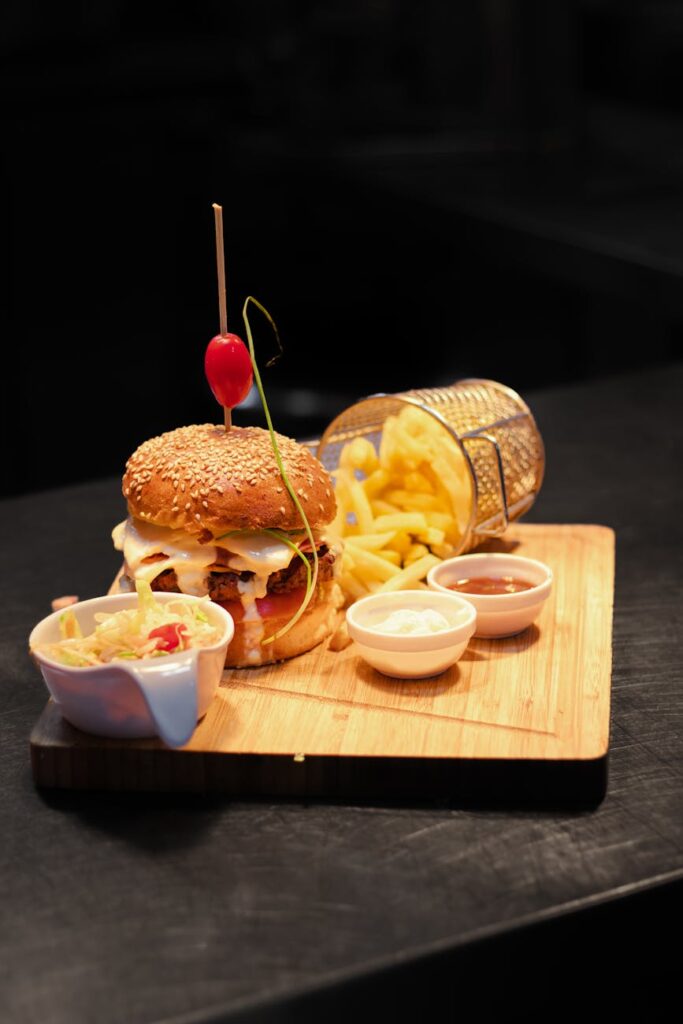 Perfectly golden-brown pan-fried tofu cubes tossed with vibrant green broccoli florets and sprinkled with sesame seeds in a white dish.