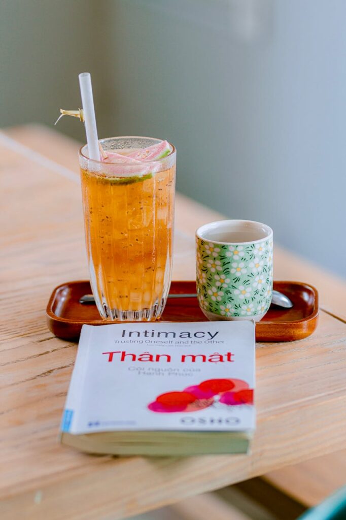 A warm, inviting mug of green tea, a powerful antioxidant, garnished with a slice of fresh lemon.