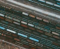 A conceptual image of a glowing digital network overlaid on a warehouse, representing the future of supply chain management.