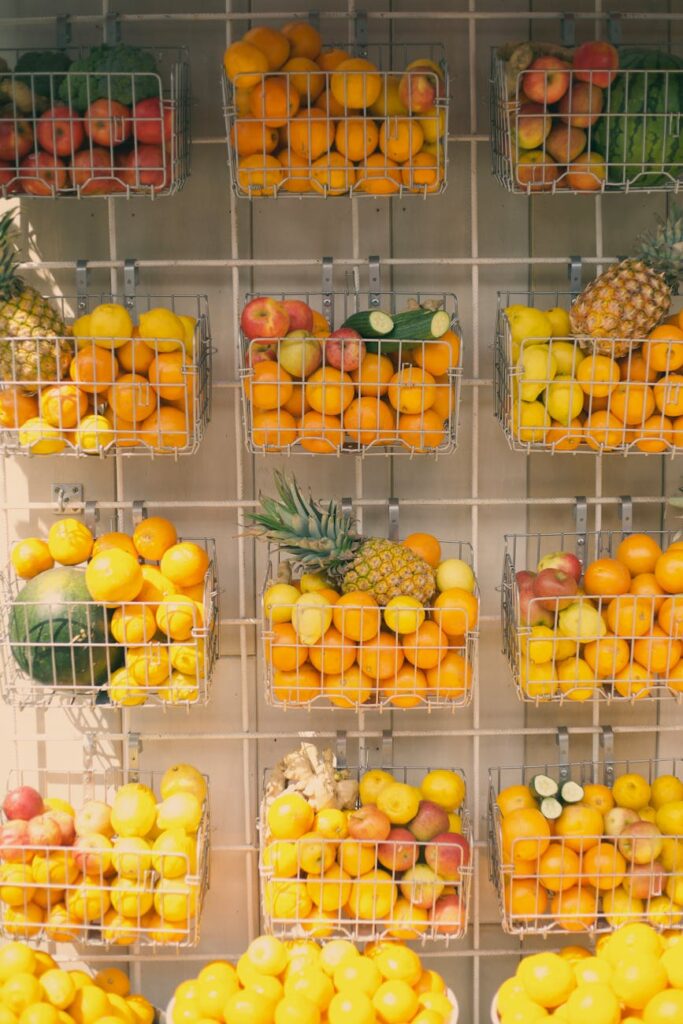 A vibrant overhead view of a market stall filled with fresh fruits and vegetables like berries, leafy greens, and bell peppers.