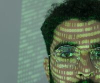 An abstract digital visualization of interconnected nodes representing the flow of big data.