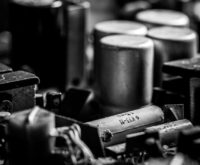 An abstract visualization of the Polkadot Relay Chain connecting multiple parachains in a hub-and-spoke model.