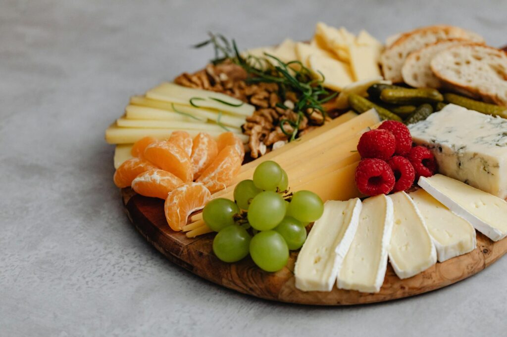 An overhead shot of healthy ingredients like avocados, berries, and spinach arranged on a wooden table, representing nutritious choices.