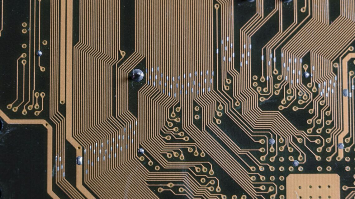 A close-up of a glowing blue and purple circuit board, representing the core of artificial intelligence.