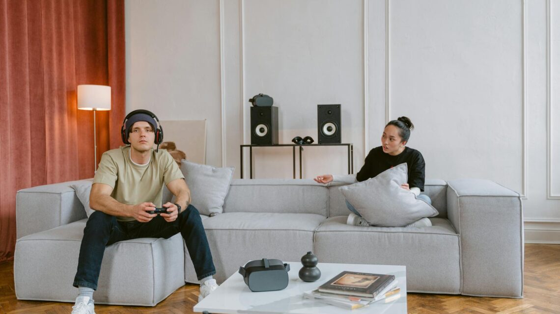 A person sitting calmly in a chair while wearing a modern VR headset, suggesting a therapeutic session.
