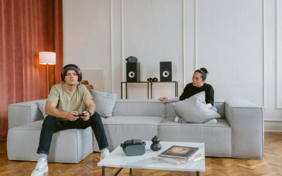 A person sitting calmly in a chair while wearing a modern VR headset, suggesting a therapeutic session.