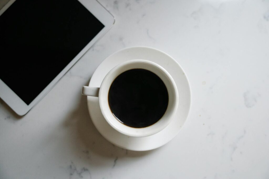 A modern farmer in a high-tech greenhouse, analyzing data on a digital tablet.