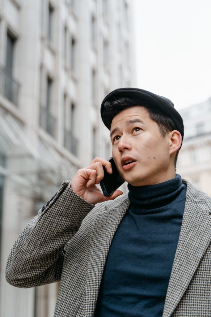 A close-up of a user interacting with a customer service chatbot on a mobile phone.