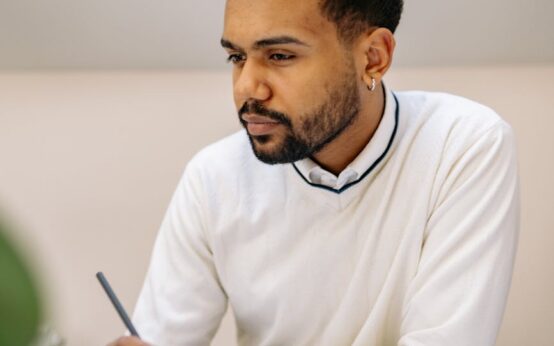 A focused entrepreneur analyzing financial growth charts on a laptop screen.