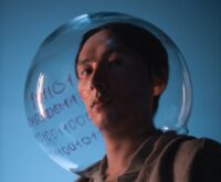 A humanoid robot touching a holographic interface displaying complex data charts, representing AI analysis.