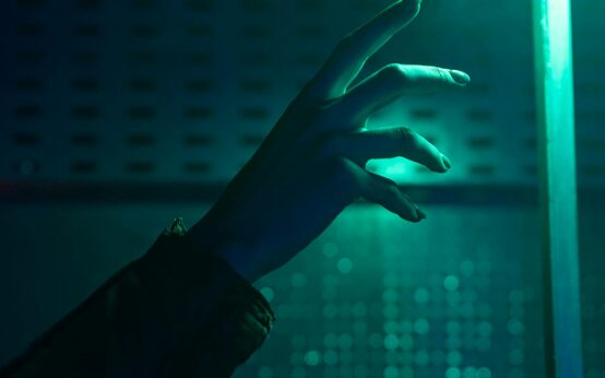 An abstract visualization of a glowing blue artificial neural network, representing AI intelligence.