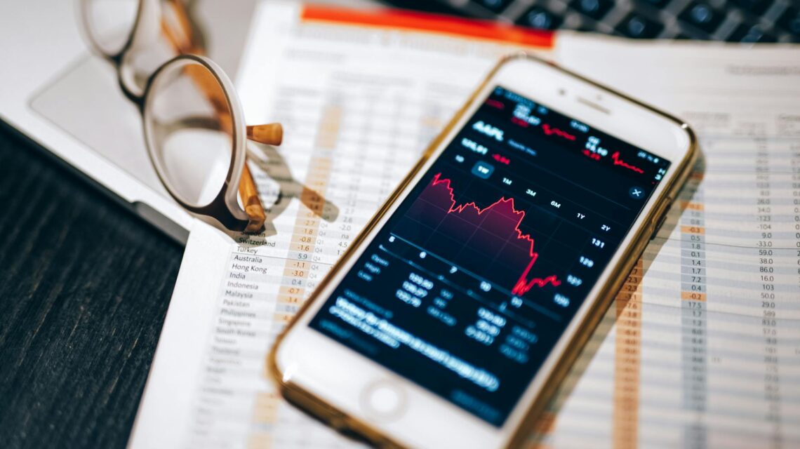 A humanoid AI robot analyzing complex sales data on a futuristic digital display, symbolizing AI in sales.