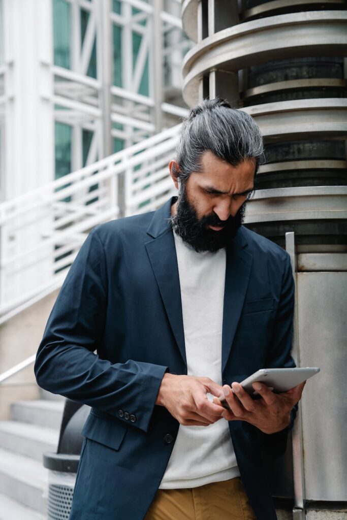 An aerial view of a busy city intersection at night with glowing lines representing AI-managed traffic flow.