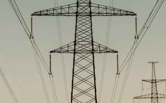 A detailed image of a glowing blue and purple artificial neural network, representing complex data connections.