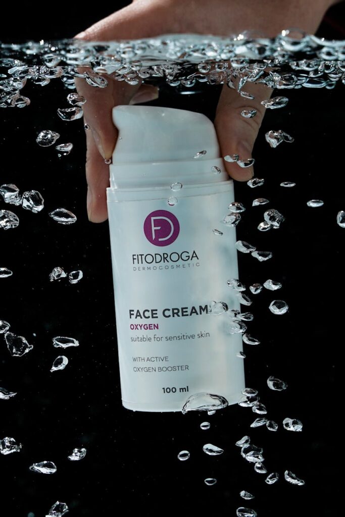 Close-up of an athlete's hand holding a ripe banana and a reusable water bottle, symbolizing post-run recovery.