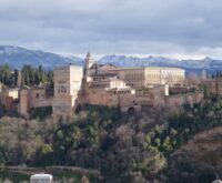 The serene Court of the Myrtles at the Alhambra, with its long reflecting pool and symmetrical archways.