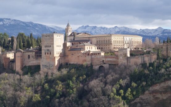 The serene Court of the Myrtles at the Alhambra, with its long reflecting pool and symmetrical archways.