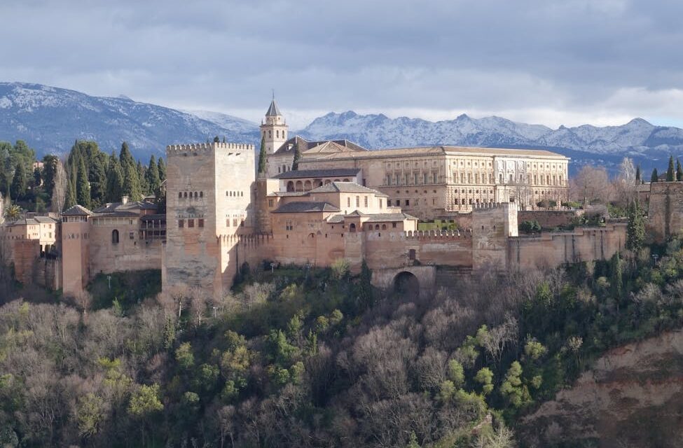 The serene Court of the Myrtles at the Alhambra, with its long reflecting pool and symmetrical archways.