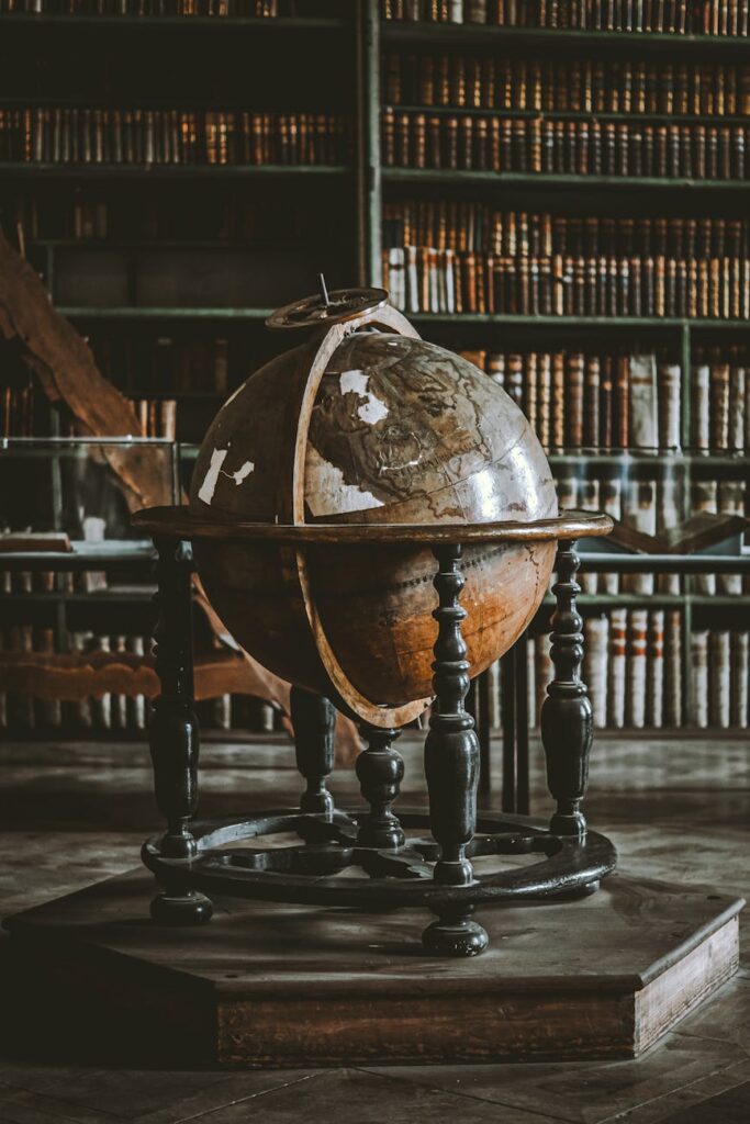 Interior of Gladstone's Library in Wales, showing multiple floors of antique books and reading desks.
