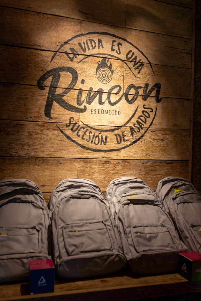 Essential backpacking equipment, including a backpack, boots, and water bottle, neatly arranged for a trip.