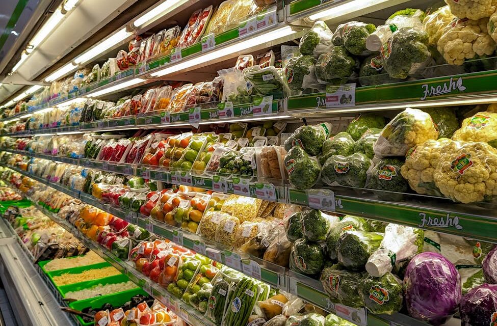 A grocery store aisle stacked high with colorful boxes and packages of processed foods.