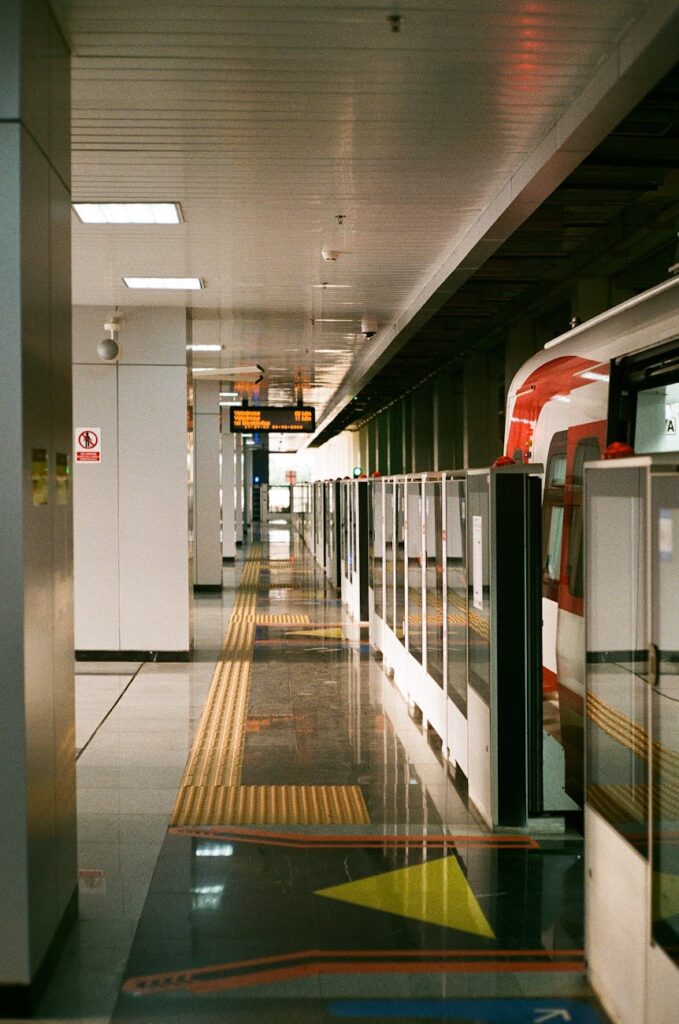 The clean and empty interior of a modern quiet train carriage with comfortable seats.